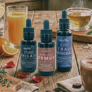 Three bottles of aquaViv supplements on a wooden table with various drinks.
