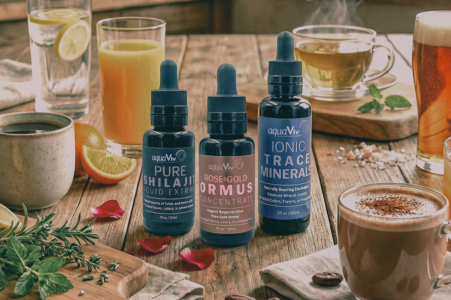 Three bottles of aquaViv supplements on a wooden table with various drinks.